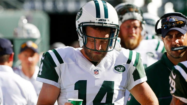 Ryan Fitzpatrick #14 of the New York Jets stands on...