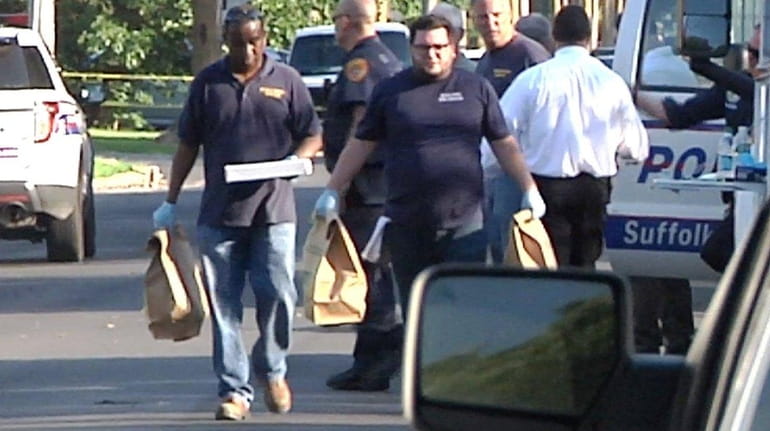 Police collect evidence after a Suffolk County officer underwent surgery...