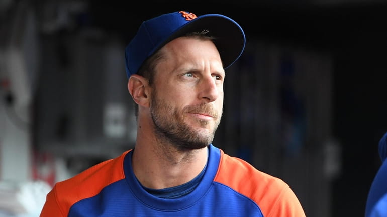 New York Mets pitcher Max Scherzer looks on from the...
