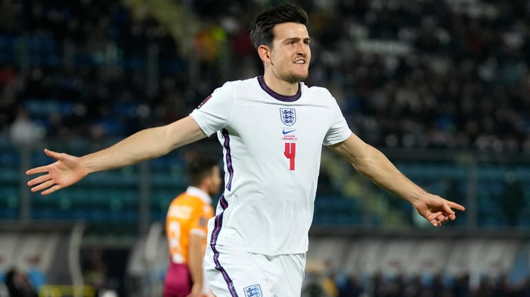FILE - England's Harry Maguire celebrates after scoring his side's...