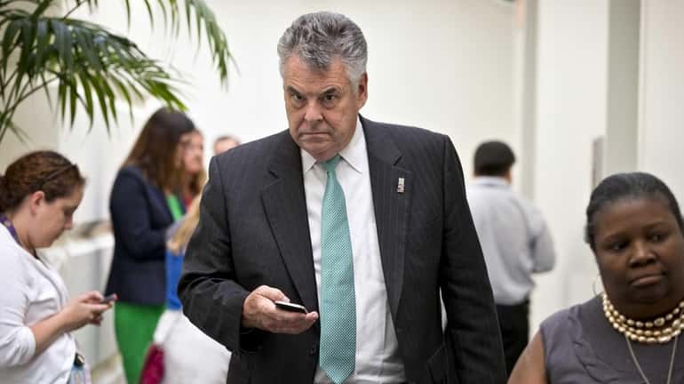Rep. Peter King emerges from a closed-door meeting with House...