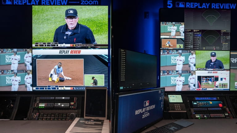 A Major League Baseball umpire is displayed alongside gameplay clips...