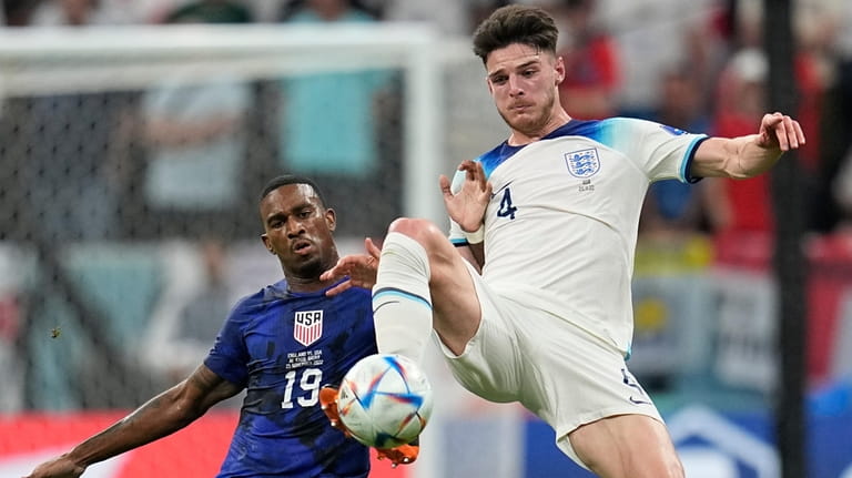 England's Declan Rice, right, and Haji Wright of the United...