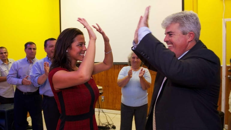 Monica Martinez celebrates her victory in the primary election for...