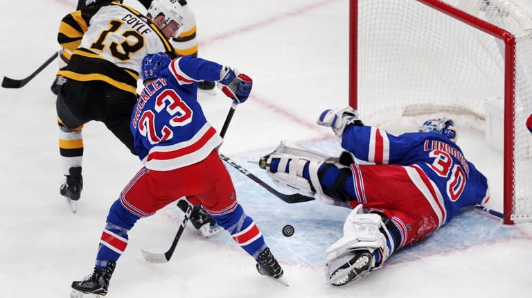 Rangers goaltender Henrik Lundqvist (30) sprawls on the ice as...