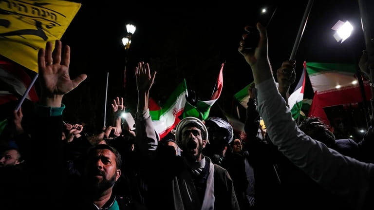 Iranian demonstrators chant slogans during an anti-Israeli gathering in front...