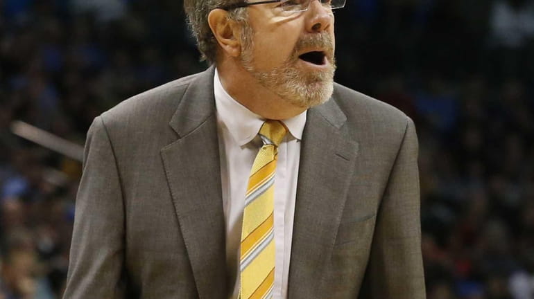 P.J. Carlesimo shouts to his team in the third quarter...