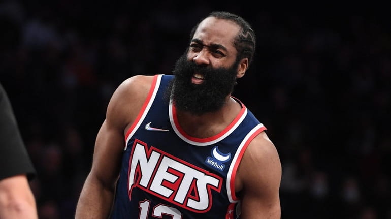 Nets guard James Harden talks to referee Pat Fraher in...