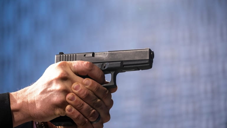 A semi-automatic Glock pistol is fired at the Bureau of...