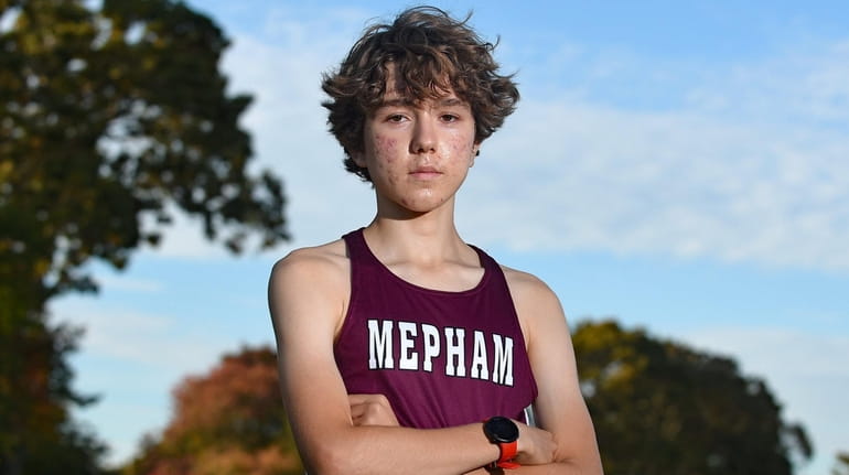 Amokrane Aouchiche, Mepham cross country runner, poses for a portrait...