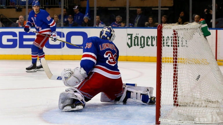 Henrik Lundqvist #30 of the New York Rangers surrenders a...