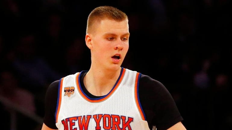Kristaps Porzingis #6 of the New York Knicks reacts after...