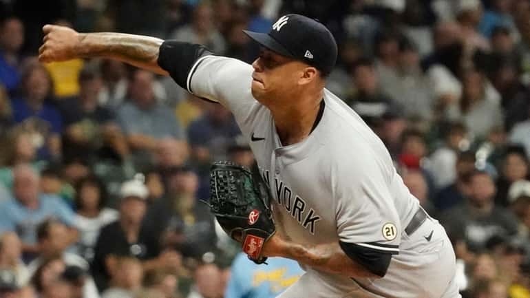 Yankees starting pitcher Frankie Montas throws during the first inning...