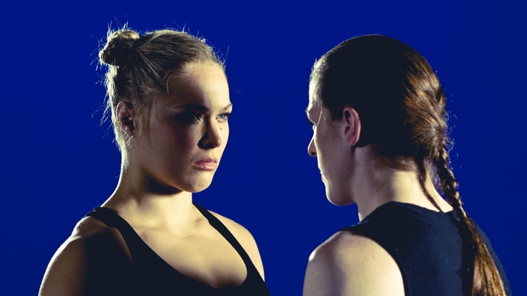 Ronda Rousey, left, at a photo shoot to promote her...