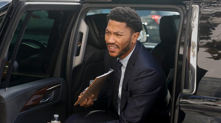 New York Knicks point guard Derrick Rose arrives at the...