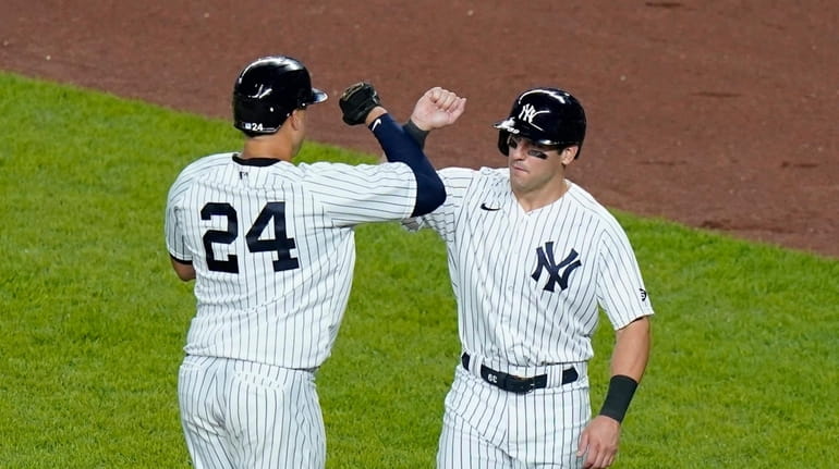 New York Yankees' Gary Sanchez, left, celebrates with teammate Mike...