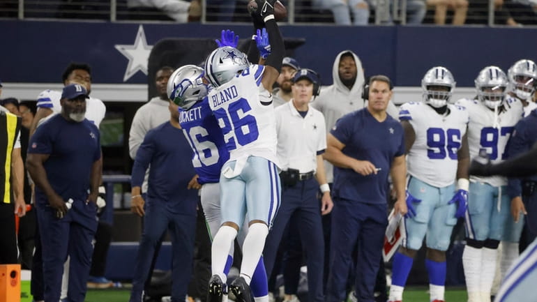 Dallas Cowboys cornerback DaRon Bland (26) intercepts a pass intended...