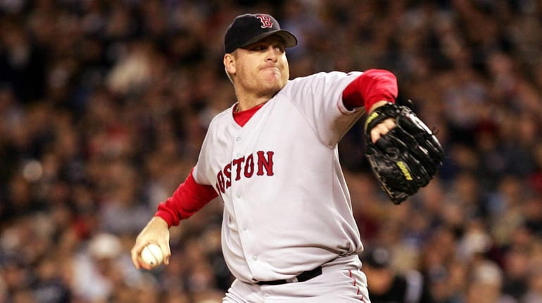 Curt Schilling of the Boston Red Sox throws a pitch...