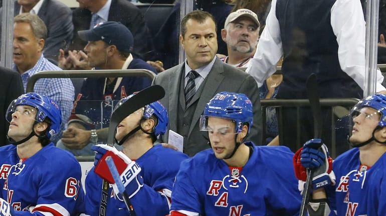 Head coach Alain Vigneault of the Rangers looks on during...