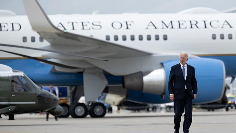 President Joe Biden walks to Air Force One at Munich...