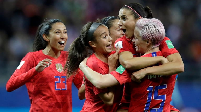 The United States' Alex Morgan, second right, celebrates after scoring...