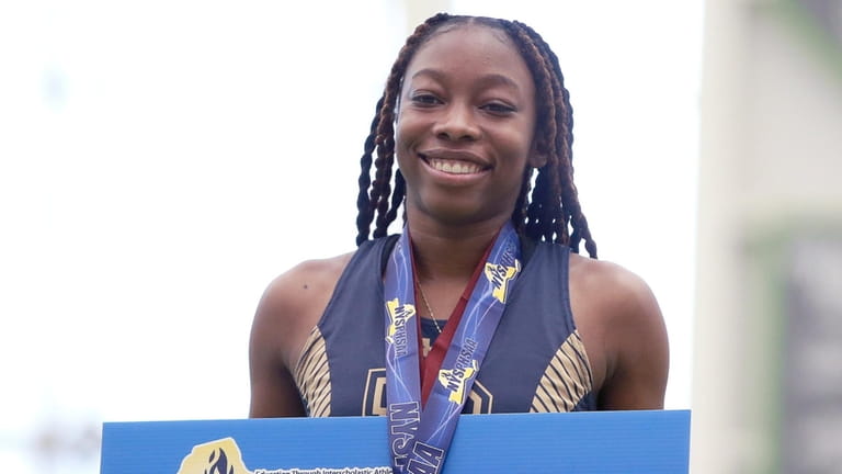 Sariah Doresca of Baldwin wins the girls 55-meter dash in...