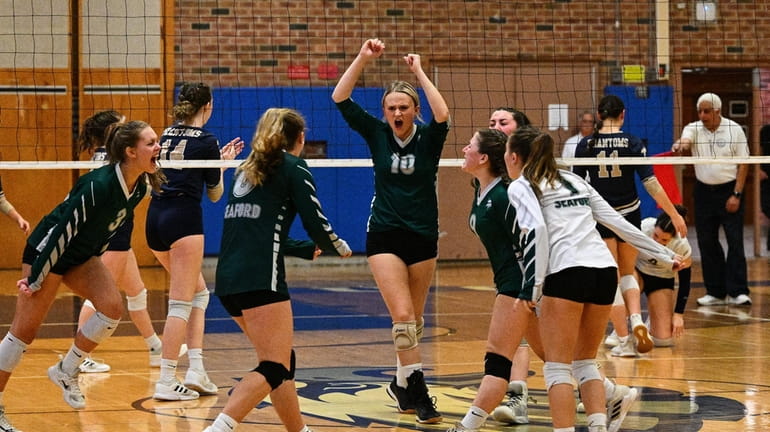 Seaford reacts after winning a point during the girls volleyball...