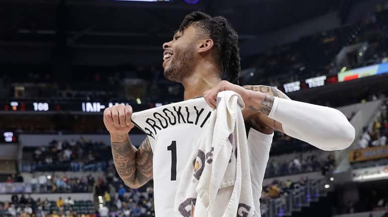 The Nets' D'Angelo Russell (1) celebrates after the Nets defeated...