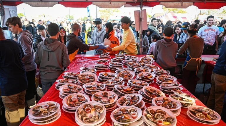 Plates of oysters are stacked for customers during the 2019...