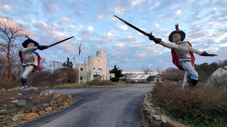 Musketeer statues guard "The Castle" in Westhampton built by sculptor Theophilus...
