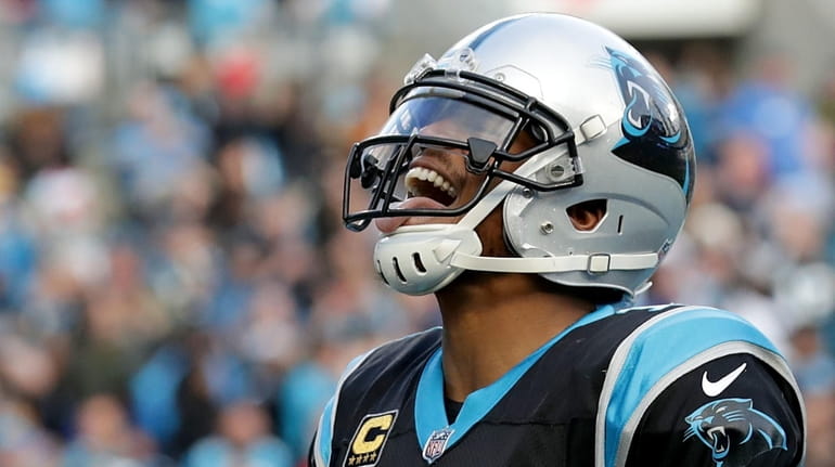 Cam Newton of the Panthers reacts after scoring the game...