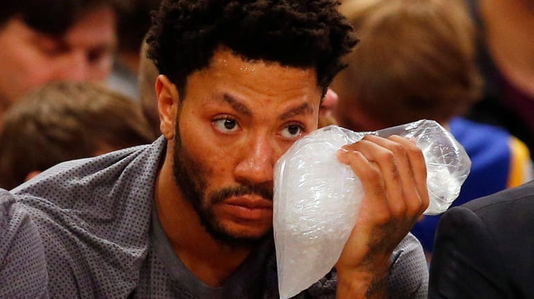 Derrick Rose of the New York Knicks sits on the...