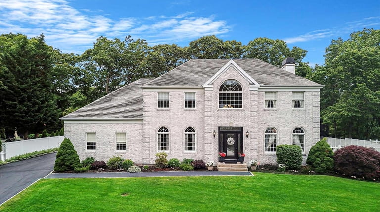 Listed for $1.125 million, this five-bedroom, 3½-bath Colonial at 20...