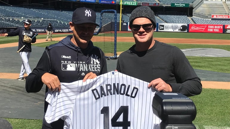 Jets quarterback Sam Darnold, right, with Yankees manager Aaron Boone...