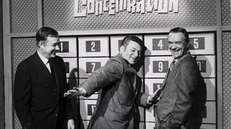 Norm Blumenthal, center, with “Concentration” host Hugh Downs, left, and...