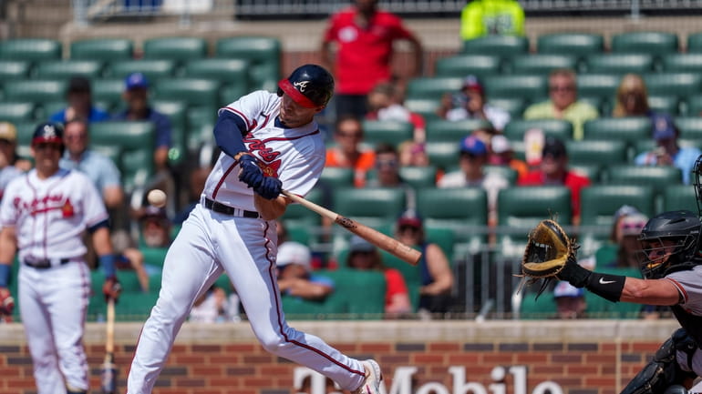 Atlanta Braves' Matt Olson (28) hits a home run in...
