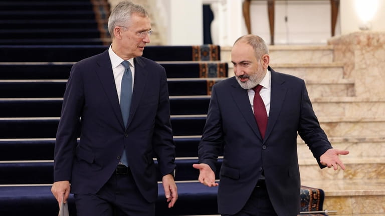 Armenia's Prime Minister Nikol Pashinyan, right, and NATO Secretary General...