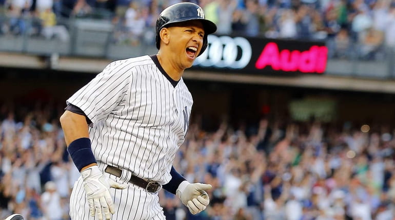 Alex Rodriguez #13 of the Yankees reacts after career hit...