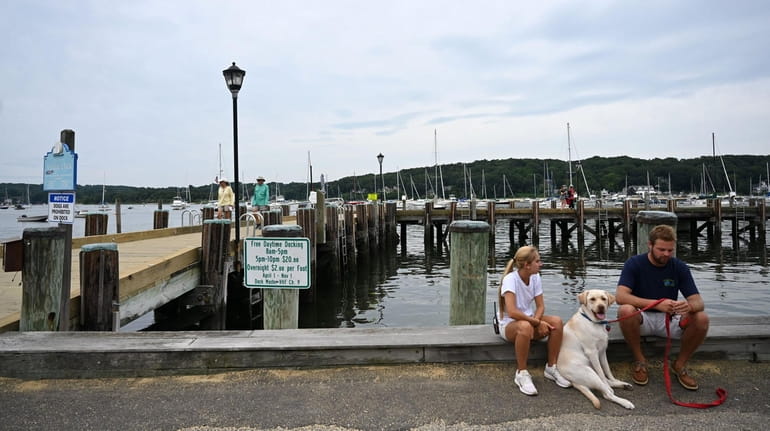 Northport Village Park faces a boat-studded harbor and attracts visitors to...