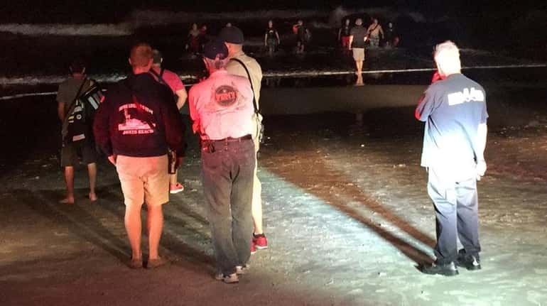Emergency personnel search for missing swimmer who was reported missing...