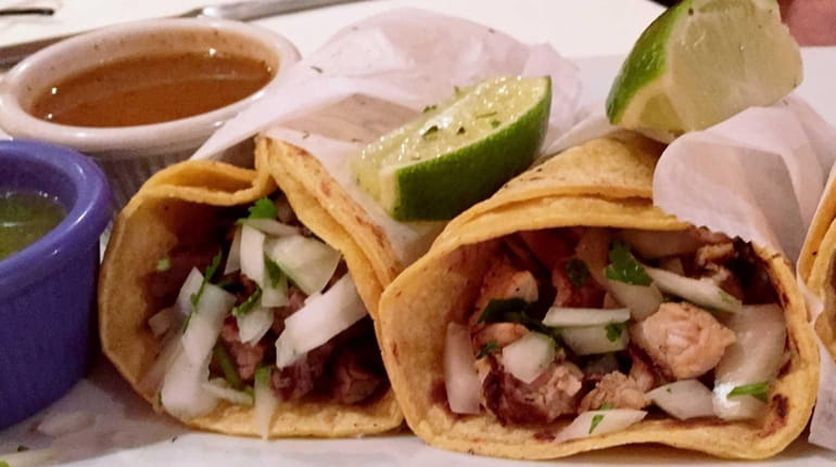 Mexican-style tacos with steak, chicken and chorizo at Escorza's Mexican...