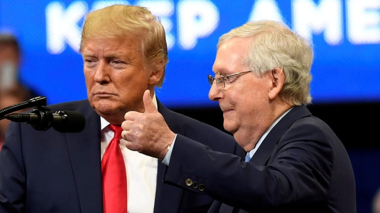 President Donald Trump with Senate Majority Leader Mitch McConnell on...