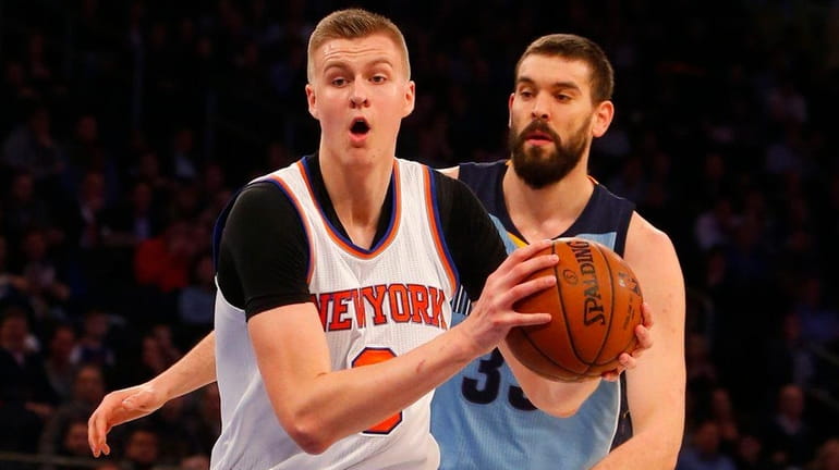 Kristaps Porzingis #6 of the New York Knicks drives to...