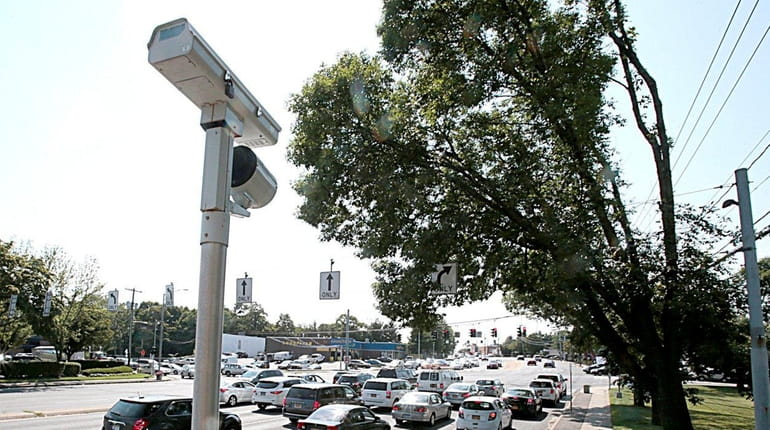 A red-light camera at Townline Road and Jericho Turnpike in...