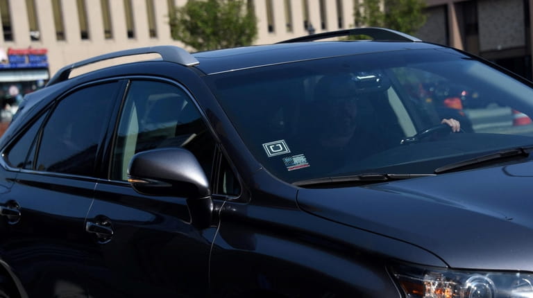 An Uber driver pulls into the Hicksville LIRR station on...