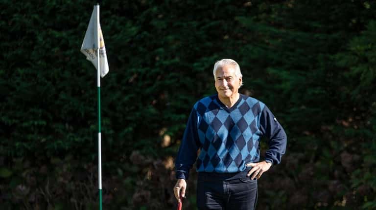 Gene Bernstein on his putting green at home in Southampton. ...
