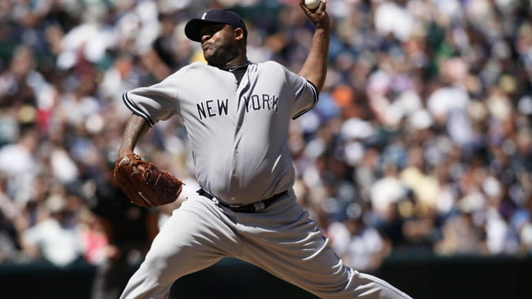 Yankees' CC Sabathia pitches to the Seattle Mariners during the...