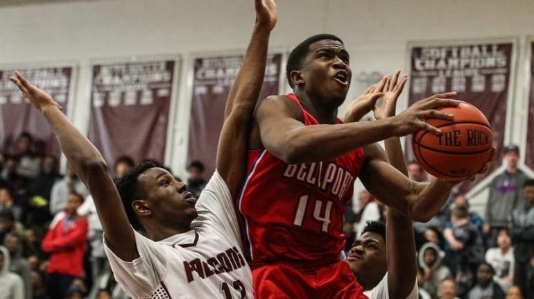 Bellport's Jarell White goes up for the layup against De'Shawn...