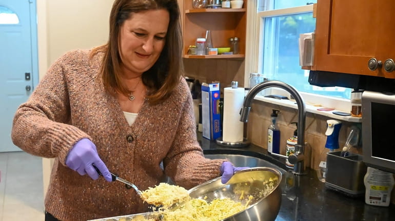 Lauren Chizner, regional coordinator for nonprofit Lasagna Love, prepares lasagna at her Dix Hills...