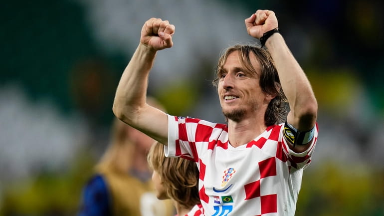 Luka Modric celebrates after Croatia defeated Brazil in a penalty...